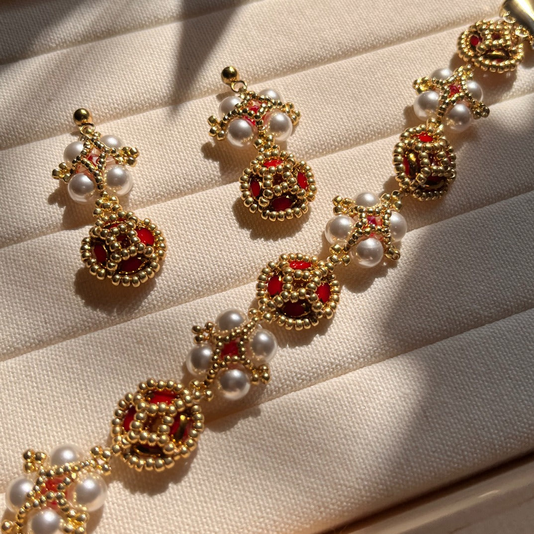 Exquisite Beaded Jewelry Set: Earrings and Bracelet with Pearl, Red Accent, and Golden Detailing